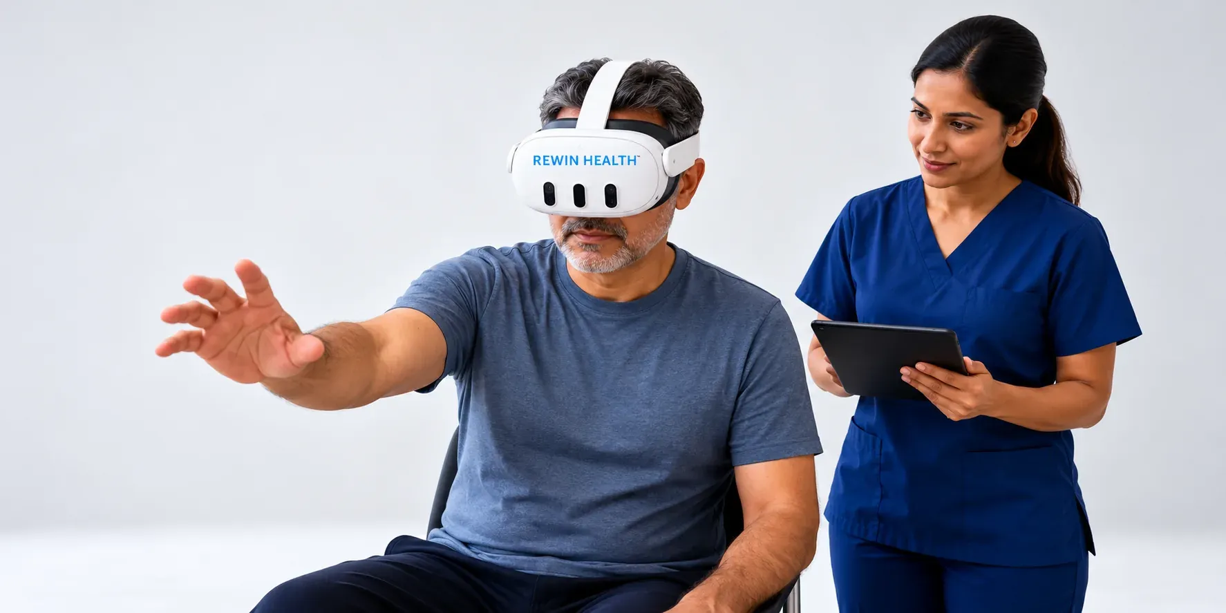 A patient wearing the Rewin VR headset reaches forward during a VR exercise while his physiotherapist follows the session on a tablet